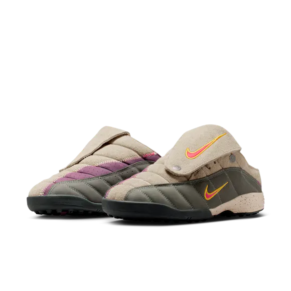 Hero image for Nike × Kids of Immigrants T-90 Mule "Khaki/University Gold."